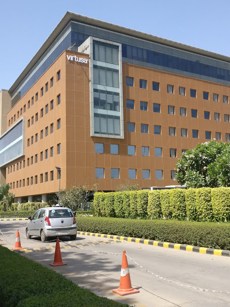 Building directory signage integrated into a stone wall